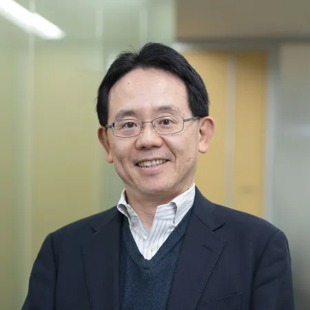 Headshot of Satoshi Hirose smiling at the camera