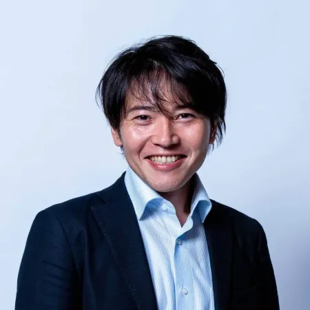 Headshot of Shingo Daidoji smiling at the camera