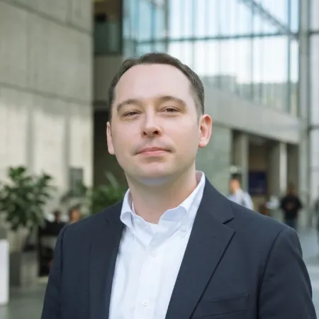 Headshot of Stuart Parsons smiling at the camera